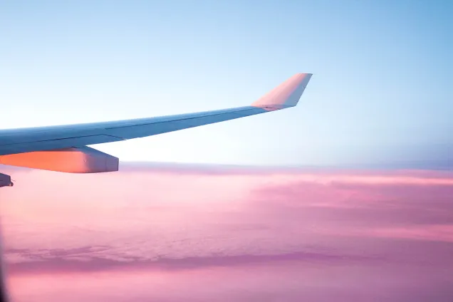 purple and blue skyscape with aeroplane wing 
